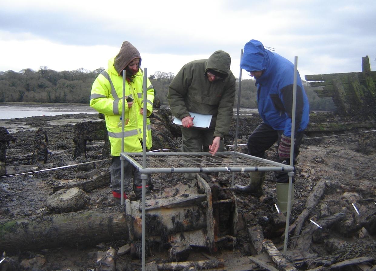 Volunteers from the Dyfed Archaeological Trust carrying out Planning Frame exercises on the wreck of the Helping Hand at Lawrenny